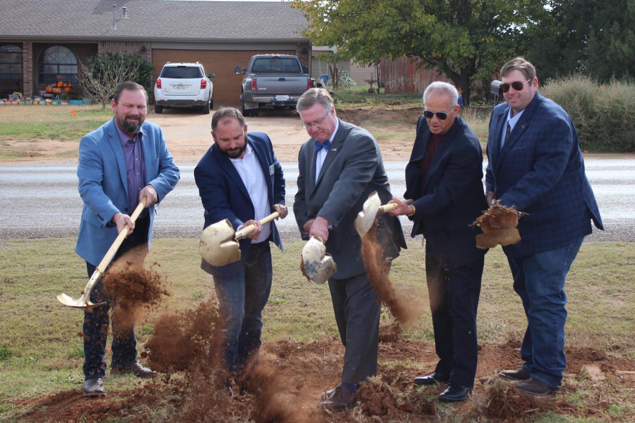 From left, Lubbock County Commissioners Terence Kovar and Jason Corley, Judge Curtis Parrish, and Commissioners Gilbert Flores and Jordan Rackler break ground on the Woodrow Road improvement project Monday near Woodrow Road and Avenue P in Woodrow.