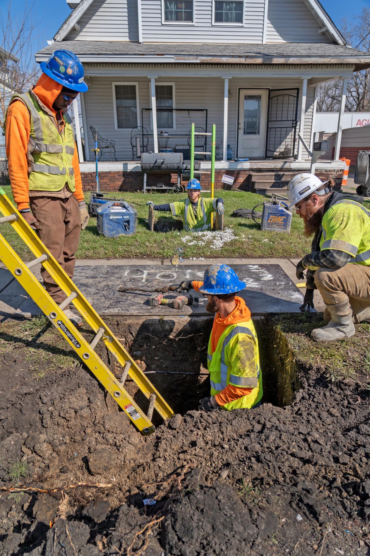 Foreman Andre Thompkins, from left, Connor Green and Casey Graves, with TSW Utility Solutions, Inc., work on the project with Citizens Energy replacing lead service lines into homes Thursday, March 28, 2024 on New York Street. Thousands of customers across Indianapolis will get new service lines free and now be protected from any possible lead getting into their water from their pipes.