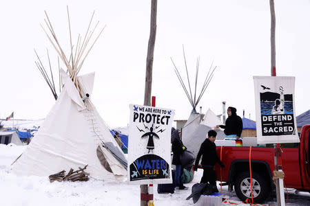 People donate food and equipment to campers inside of the Oceti Sakowin camp as "water protectors" continue to demonstrate against plans to pass the Dakota Access pipeline near the Standing Rock Indian Reservation, near Cannon Ball, North Dakota, U.S., December 2, 2016. REUTERS/Lucas Jackson