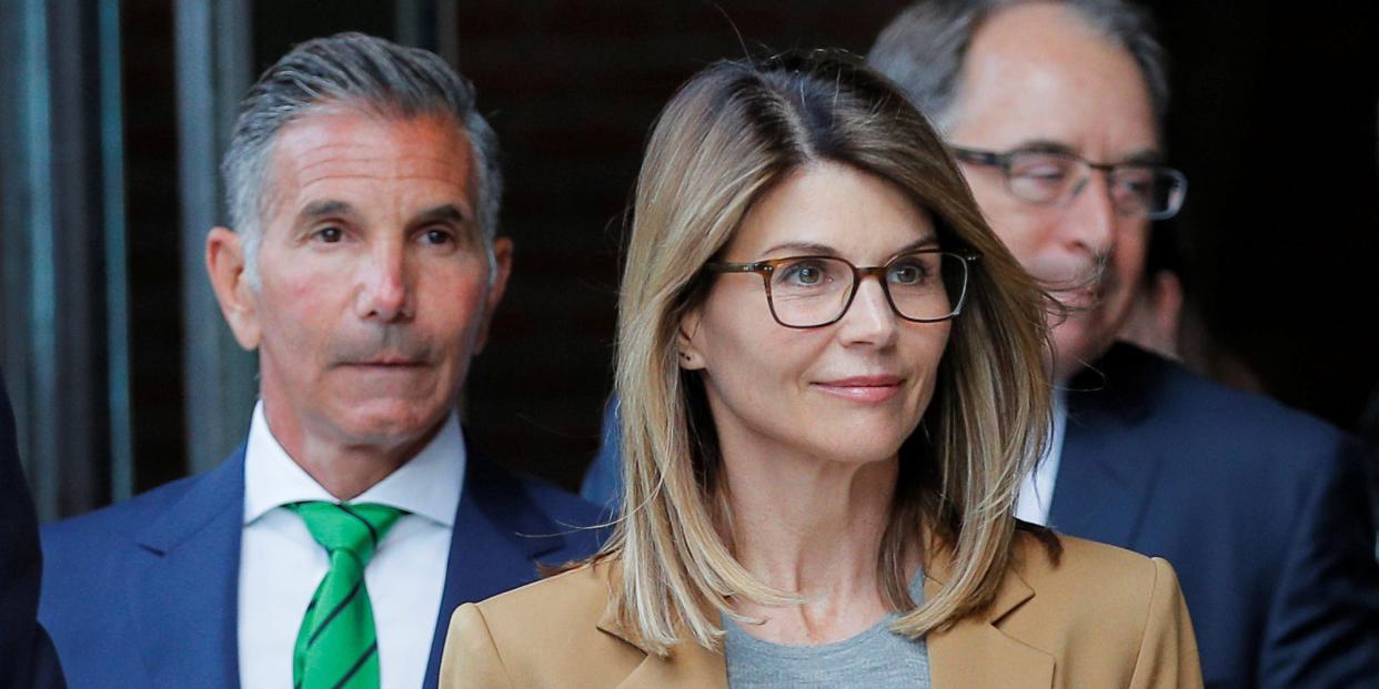 Actor Lori Loughlin, and her husband, fashion designer Mossimo Giannulli, leave the federal courthouse after facing charges in a nationwide college admissions cheating scheme, in Boston, Massachusetts,.JPG
