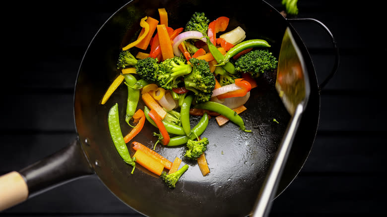 vegetables stir frying in wok