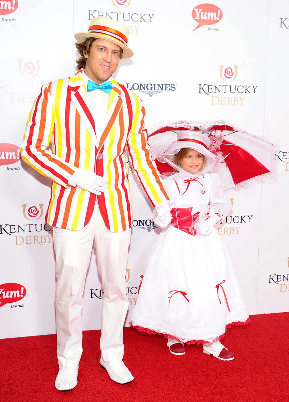 <p>Dad and daughter chose a Mary Poppins theme for their 2013 ensembles. She was Mary, of course, and he was Bert, just as audiences saw them in the “Jolly Holiday” section of the classic Disney movie. (Photo: Michael Loccisano/Getty Images) </p>