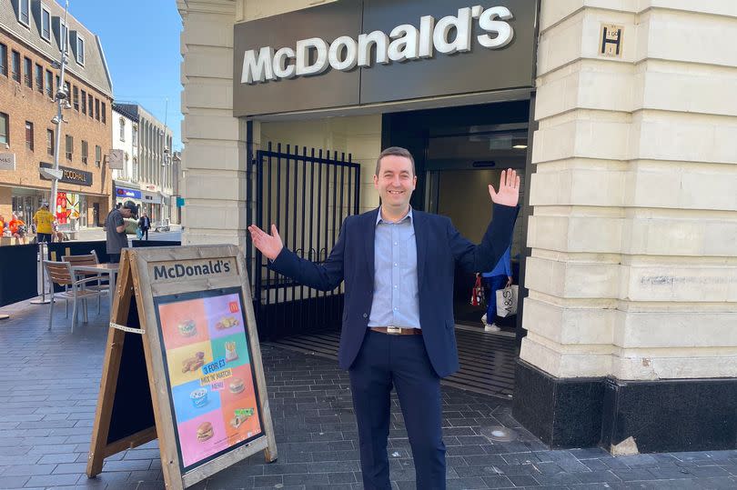 McDonald's supervisor and area manage Ben Norvock outside the Grimsby town centre restaurant which has reopened after a water leak