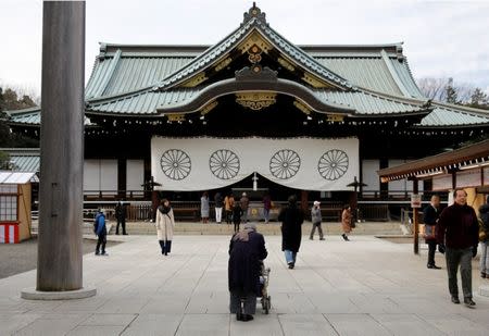 Visitors walk at the Yasukuni Shrine in Tokyo, Japan, December 29, 2016. REUTERS/Toru Hanai