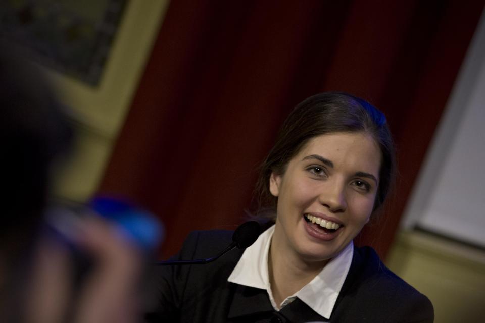 Russian punk band Pussy Riot member Nadezhda Tolokonnikova smiles when responding to questions from the media during a press conference as part of a human rights weekend in Amsterdam, Netherlands, Friday, Jan. 31, 2014. Tolokonnikova and Maria Alekhina were released from prison last month after serving 21 months for hooliganism following their March 2012 arrest for giving an unauthorized performance in Christ The Savior Cathedral in Moscow, Russia. (AP Photo/Peter Dejong)