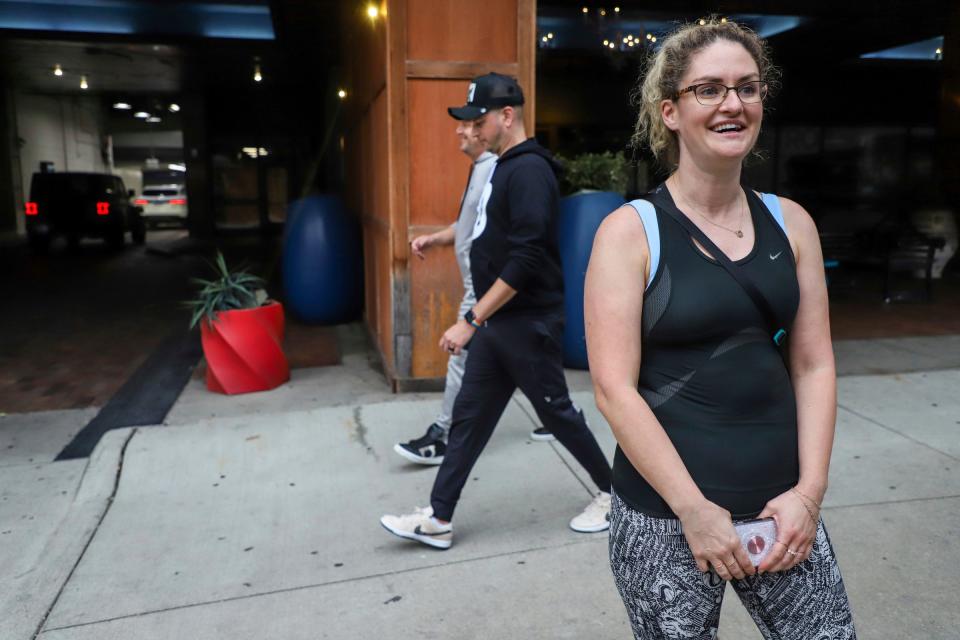 Shannon Jackson, 34, of Detroit, carries a bag of cat food she just purchased at Premier Pet Supply in downtown Detroit on Sept. 29, 2023. Jackson says she lived in downtown Detroit before purchasing a home on E. Jefferson Avenue near Belle Isle and loves to come downtown to exercise.