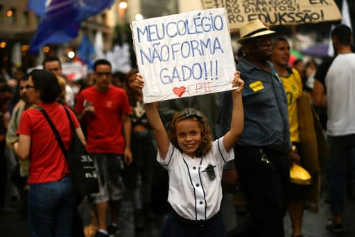 A girl demonstrates in Rio de Janeiro, on May 15, 2019