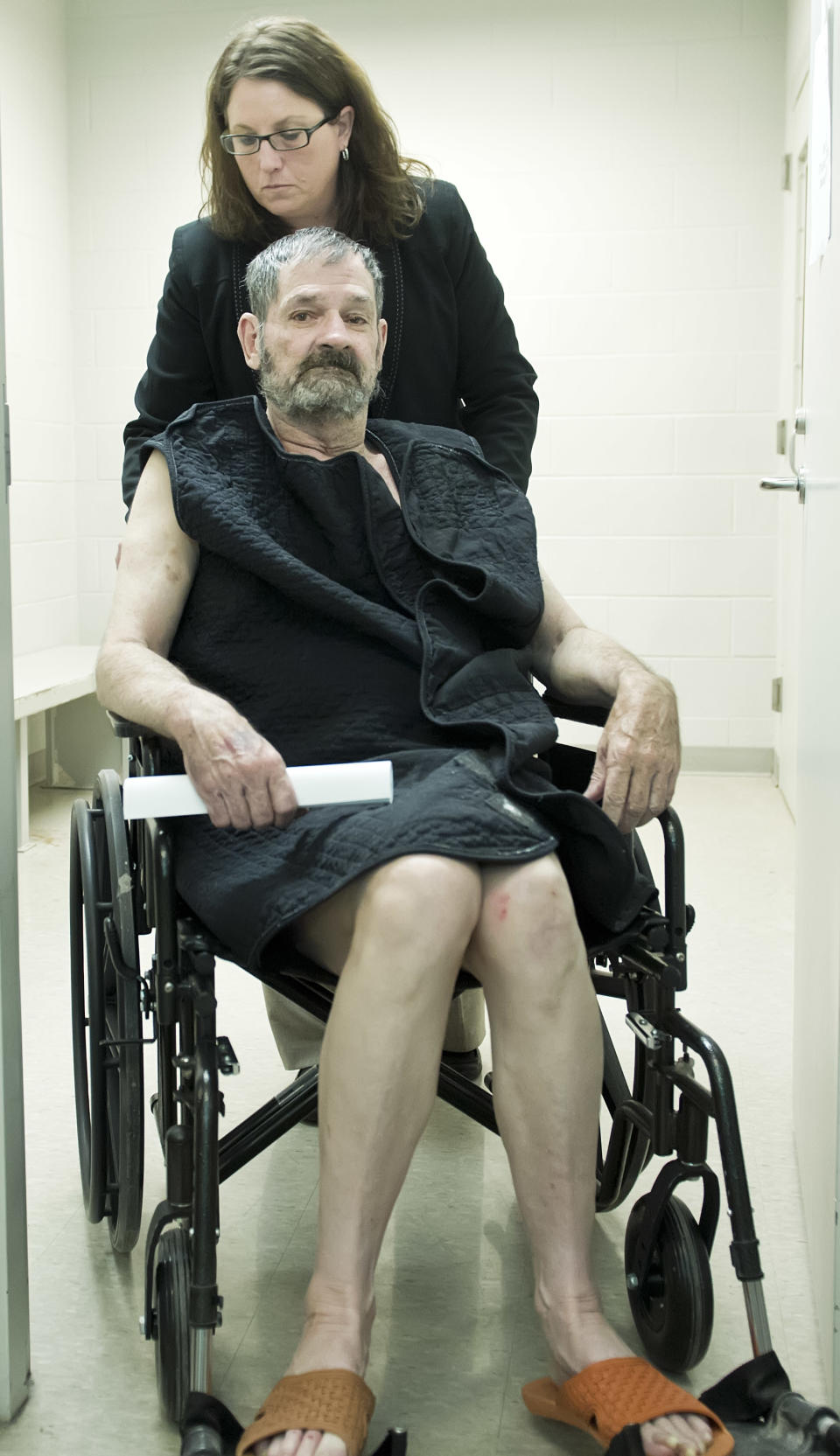 Frazier Glenn Cross, also known as Frazier Glenn Miller, appears at his arraignment in New Century, Kan., Tuesday, April 15, 2014. Cross is being charged for shootings that left three people dead at two Jewish community sites in suburban Kansas City on April 13. At top is Michelle Durrett, attorney with the public defender's office. (AP Photo/The Kansas City Star, David Eulitt, Pool)