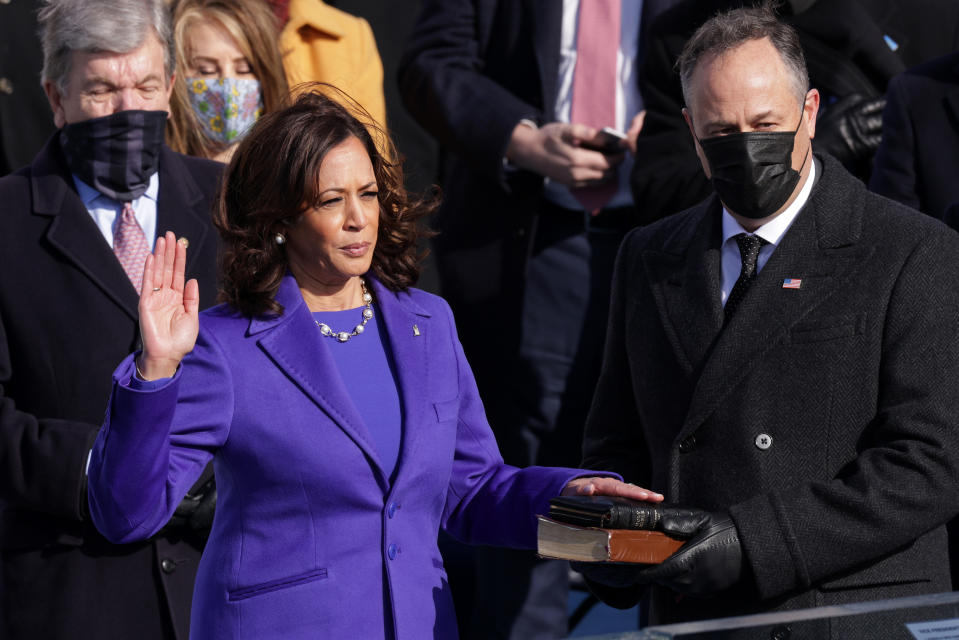 WASHINGTON, DC - JANUARY 20:  Kamala Harris is sworn as U.S. Vice President by U.S. Supreme Court Associate Justice Sonia Sotomayor as her husband Doug Emhoff looks on at the inauguration of U.S. President-elect Joe Biden on the West Front of the U.S. Capitol on January 20, 2021 in Washington, DC.  During today's inauguration ceremony Joe Biden becomes the 46th president of the United States. (Photo by Alex Wong/Getty Images)