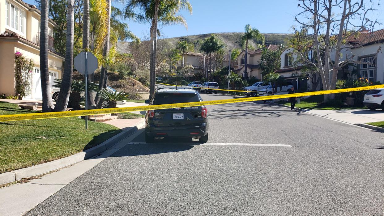 Yellow tape blocked off Dusty Rose Court in Simi Valley as police investigated a gunfire incident that killed a man and left a woman in critical condition on Tuesday, Jan. 25, 2022.