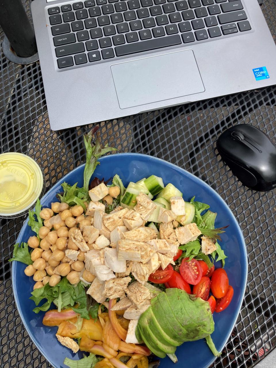 Working lunch at Bobo's House Salad at Bobo's Cafe in Chappaqua. The salad includes chickpeas, cherry tomatoes, tumeric pickled red onions, and cucumber with white balsamic vinaigrette with chicken and avocado additions. Photographed June 7, 2022.