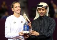 Tennis - Qatar Open - Women's Singles - Final Match - Karolina Pliskova of the Czech Republic v Caroline Wozniacki of Denmark - Doha, Qatar - 18/2/2017 - Pliskova receives the trophy. REUTERS/Ibraheem Al Omari