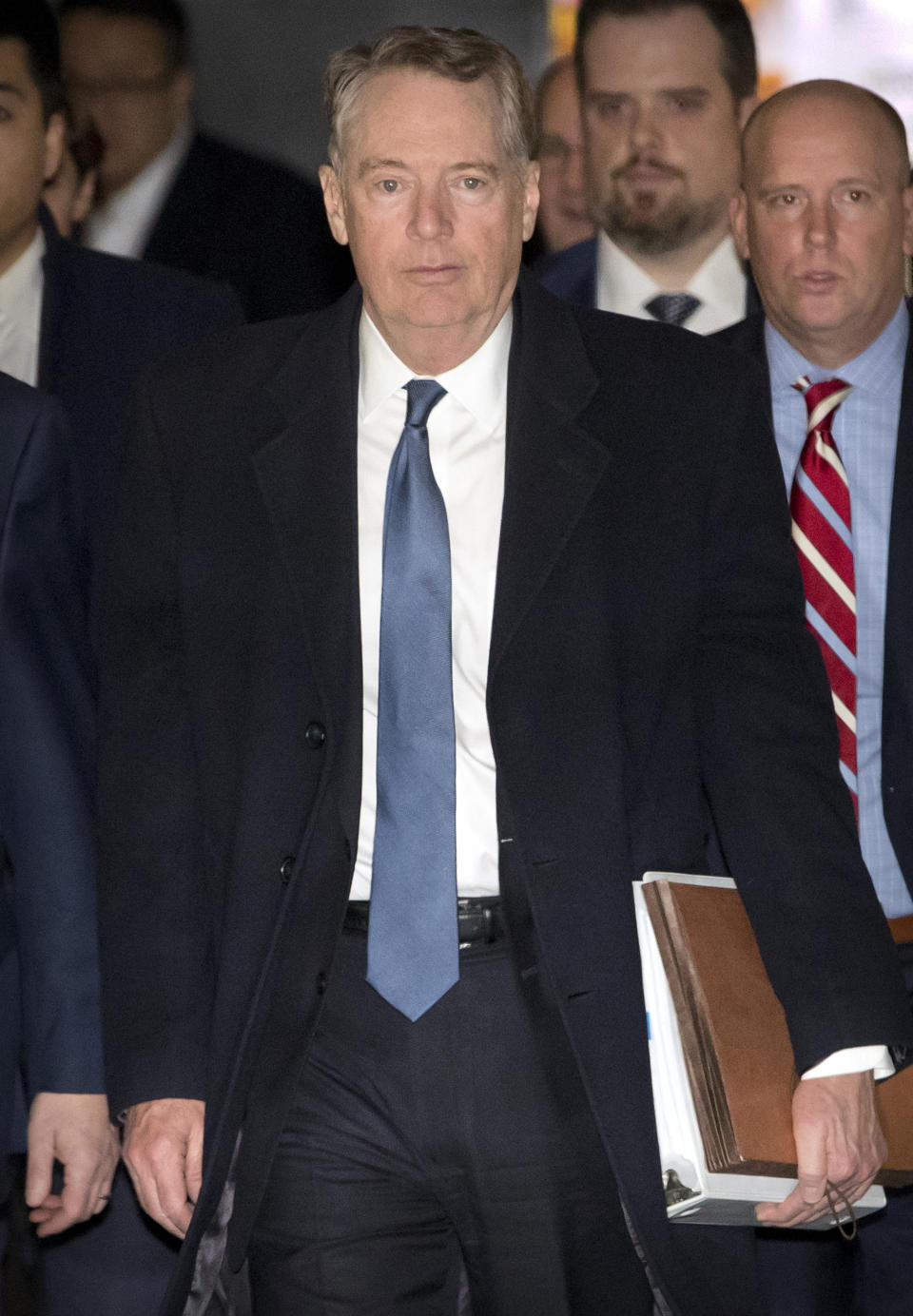 U.S. Trade Representative Robert Lighthizer leaves his hotel in Beijing, Friday, Feb. 15, 2019. U.S. and Chinese negotiators opened talks Thursday on a sprawling trade dispute as Beijing reported its January exports rebounded despite President Donald Trump's tariff hikes. (AP Photo/Mark Schiefelbein)