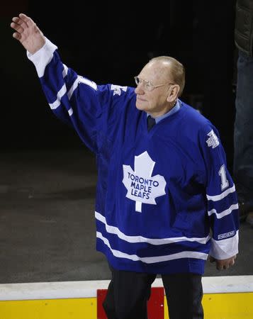 FILE PHOTO - Toronto Maple Leafs great goalie Johnny Bower waves during a pre-game ceremony before the team's NHL hockey game against the Montreal Canadiens in Montreal, January 8, 2009. REUTERS/Shaun Best