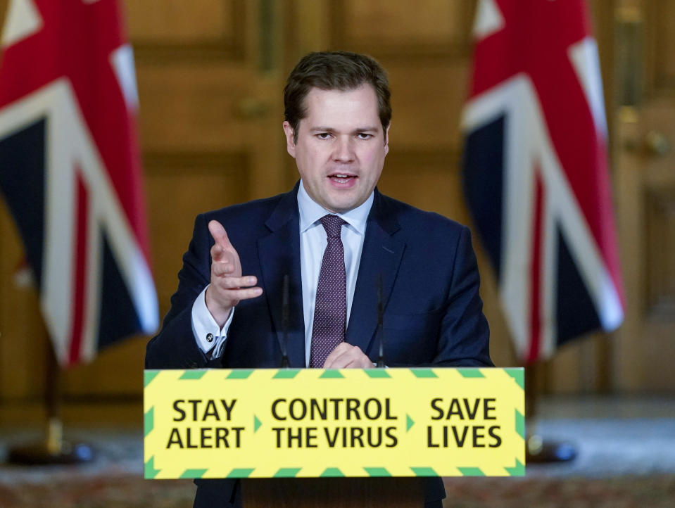 In this photo issued by 10 Downing Street, Britain's Housing, Communities and Local Government Secretary Robert Jenrick speaks during a coronavirus media briefing in Downing Street, London, Wednesday May 13, 2020. (Andrew Parsons/10 Downing Street via AP)