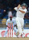 Cricketer Ed Cowan of Australia launches a four during the first day of the second-of-three Test matches between Australia and West Indies on April 15, 2012 at Queen's Park Oval in Port of Spain, Trinidad. AFP PHOTO/Stan HONDA (Photo credit should read STAN HONDA/AFP/Getty Images)