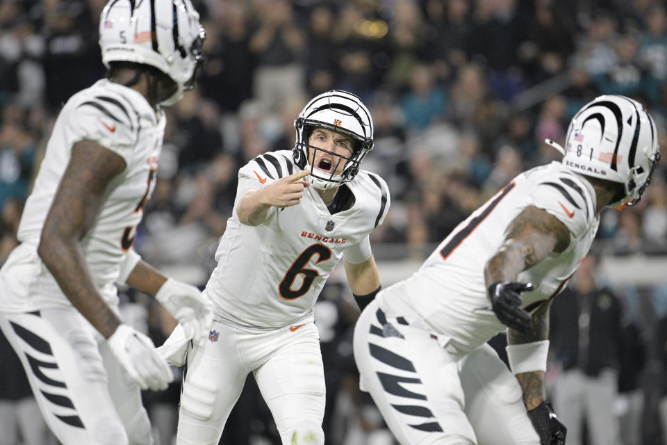 Cincinnati Bengals quarterback Jake Browning (6) gestures during the first half of an NFL football game against the Jacksonville Jaguars, Monday, Dec. 4, 2023, in Jacksonville, Fla. (AP Photo/Phelan M. Ebenhack)