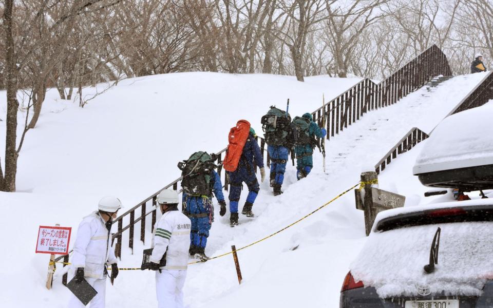 Rescue workers search for missing people - Credit: Reuters