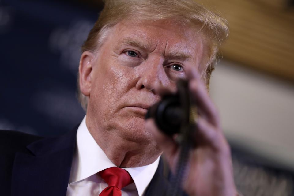 US President Donald Trump attends a news conference at the World Economic Forum in Davos, Switzerland, Wednesday, Jan. 22, 2020. Trump's two-day stay in Davos is a test of his ability to balance anger over being impeached with a desire to project leadership on the world stage. (AP Photo/Evan Vucci)