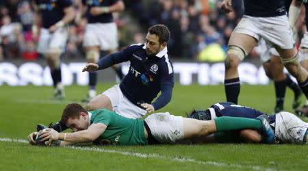 Britain Rugby Union - Scotland v Ireland - Six Nations Championship - BT Murrayfield Stadium, Edinburgh - 4/2/17 Paddy Jackson of Ireland scores try as he is tackled by Josh Strauss of Scotland Reuters / Russell Cheyne Livepic