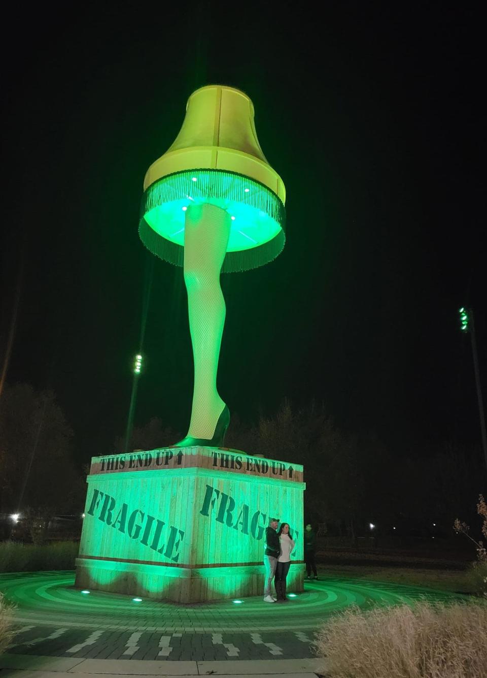 Visitors check out the 50-foot-tall Chickasha Leg Lamp Dec. 3 in downtown Chickasha.