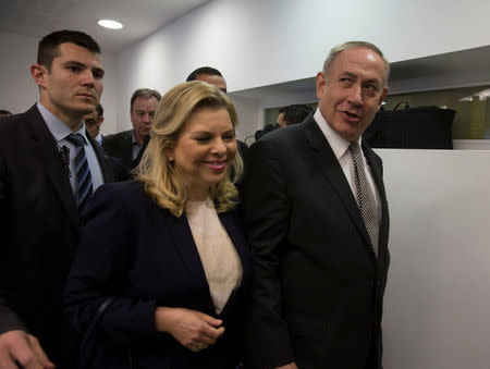 Israeli Prime Minister Benjamin Netanyahu (R) and his wife Sara arrive at a courtroom to testify in a libel lawsuit they filed against an Israeli journalist, at the Magistrate Court in Tel Aviv, Israel March 14, 2017. REUTERS/Heidi Levine/Pool