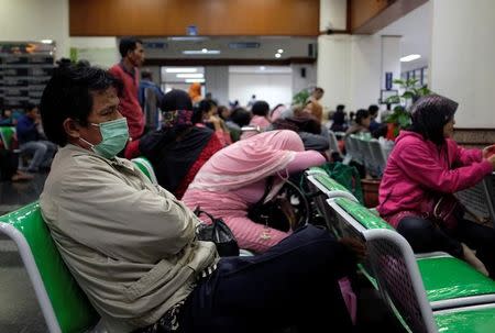 Patients and family wait for their turn to register at Dharmais Hospital, IndonesiaÕs biggest cancer hospital, after the institution suffered cyber attacks affecting scores of computers in Jakarta, Indonesia May 15, 2017. REUTERS/Darren Whiteside