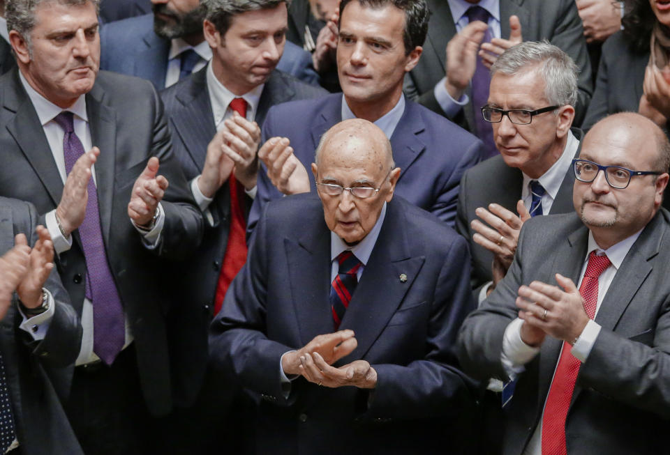 FILE - Former Italian President Giorgio Napolitano, center, applauds the election of Sergio Mattarella as his successor, at the end of a voting session for the election of the new Italian President at the lower chamber in Rome, Saturday, Jan. 31, 2015. Giorgio Napolitano, the first former Communist to rise to Italy’s top job — president of the Republic — and the first president to be re-elected, has died Friday, Sept. 22, 2023. He was 98. (AP Photo/Andrew Medichini, File)