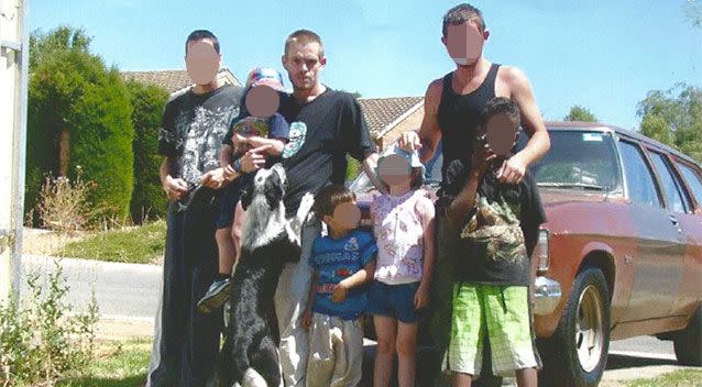 Convicted killer Luke Hutchings (centre) with his adopted brothers and other family members. Photo: iExpress