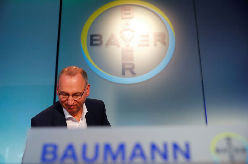 FILE PHOTO: Werner Baumann, CEO of Bayer AG, arrives for the annual results news conference of the German drugmaker in Leverkusen