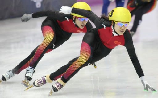 Chinese Liu Qiuhong (R) and her compatriot Yui Sakai skate during the 500 metre women's short track event during the 7th Asian Winter Games Astatna. was in complete command in the women's 500m distance leading the race from the start to finish 0.76sec ahead of a compatriot Fan Kexin. Japan's Yui Sakai clinched the bronze medal