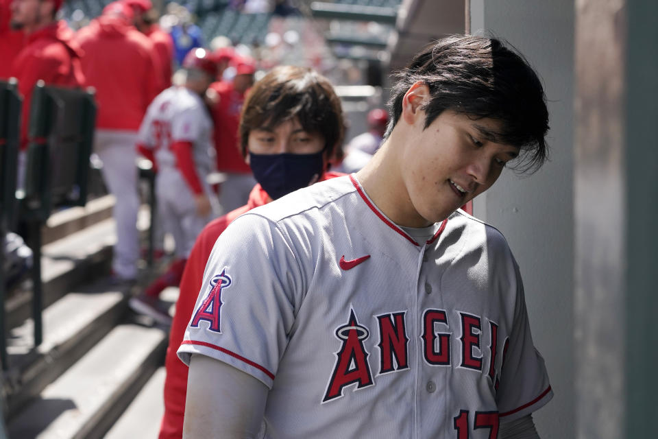 Los Angeles Angels Shohei Ohtani heads into the clubhouse at the end of the top of the first inning after being hit by a pitch but staying in the baseball game against the Seattle Mariners, Sunday, May 2, 2021, in Seattle. (AP Photo/Ted S. Warren)