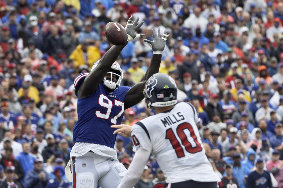 Buffalo Bills defensive end Mario Addison (97) tips a pass by Houston Texans quarterback Davis Mills (10) during the first half of an NFL football game, Sunday, Oct. 3, 2021, in Orchard Park, N.Y. (AP Photo/Adrian Kraus)