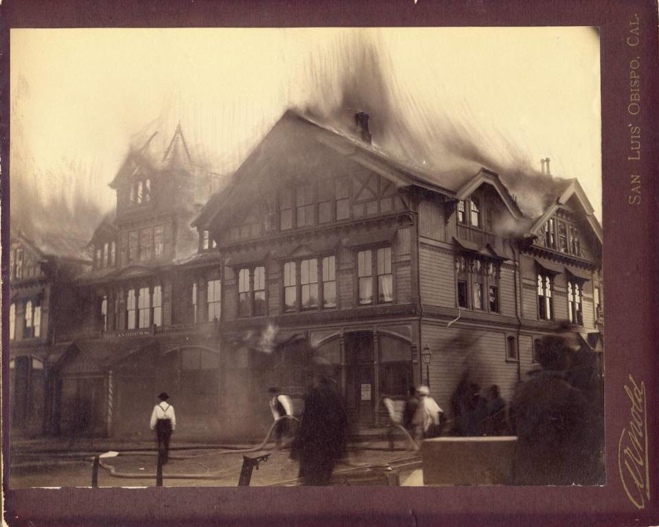 Volunteers in suspenders and bowler hats drag hoses as San Luis Obispo’s Andrews Hotel burns down in 1886.