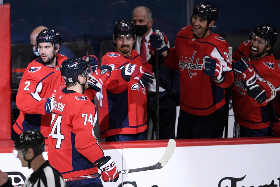 Washington Capitals defenseman John Carlson (74) celebrates his goal during the shootout of an NHL hockey game against the Buffalo Sabres, Friday, Jan. 22, 2021, in Washington. (AP Photo/Nick Wass)