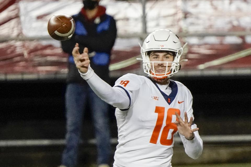 Illinois quarterback Brandon Peters throws a pass during the first half of an NCAA college football game against Wisconsin Friday, Oct. 23, 2020, in Madison, Wis. (AP Photo/Morry Gash)