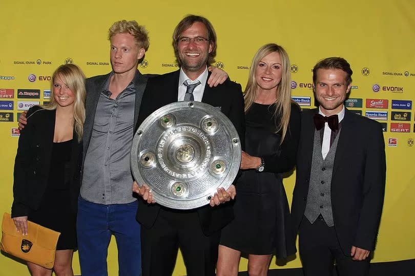 Klopp and Ulla with his son Marc on the right and her son Dennis second left ( Image: Bongarts/Getty Images) -Credit:Bongarts/Getty Images