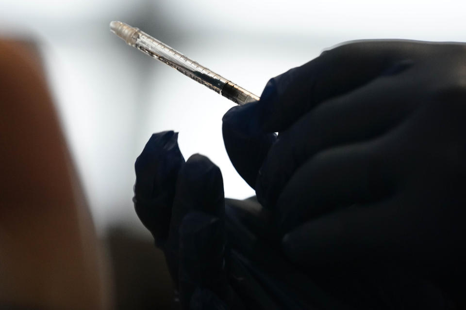 A retractable needle is seen after a person receives a vaccine at Mercedes-Benz Stadium on Thursday, March 25, 2021, in Atlanta. Gov. Brian Kemp said all Georgians 16 and older will be eligible to receive the COVID-19 vaccine. (AP Photo/Brynn Anderson)