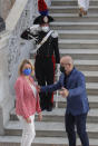 Italian Minister for Ecological Transition Roberto Cingolani, right, welcomes welcomes his French homologue Barbara Pompili as she arrives at Palazzo Reale in Naples, Italy, Thursday, July 22, 2021, to take part in a G20 meeting on environment, climate and energy. (AP Photo/Salvatore Laporta)