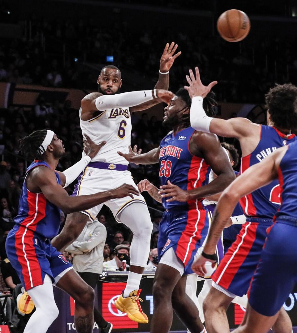Lakers forward LeBron James passes the ball over Detroit Pistons center Isaiah Stewart (28) in the first half.