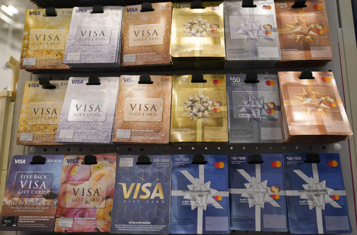 Gift cards sit on display for sale at a retail store in Dallas, Tuesday, Nov. 16, 2021. The holidays have always been defined by disappointing out-of-stock messages on the most popular items. Many shoppers will turn to more to gift cards if they don't like what they see.(AP Photo/LM Otero)