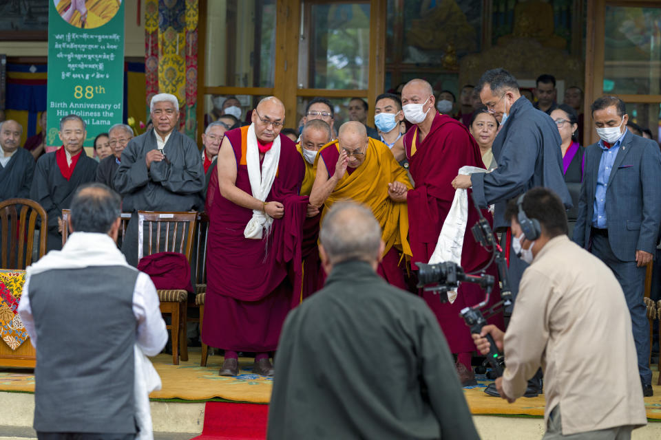 Tibetan spiritual leader the Dalai Lama greets Sukhvinder Singh Sukhu, first left, Chief Minister of Himachal Pradesh, as he arrives to wish the Tibetan leader on his 88th birthday at the Tsuglakhang temple in Dharamshala, India, Thursday, July 6, 2023. (AP Photo/Ashwini Bhatia)