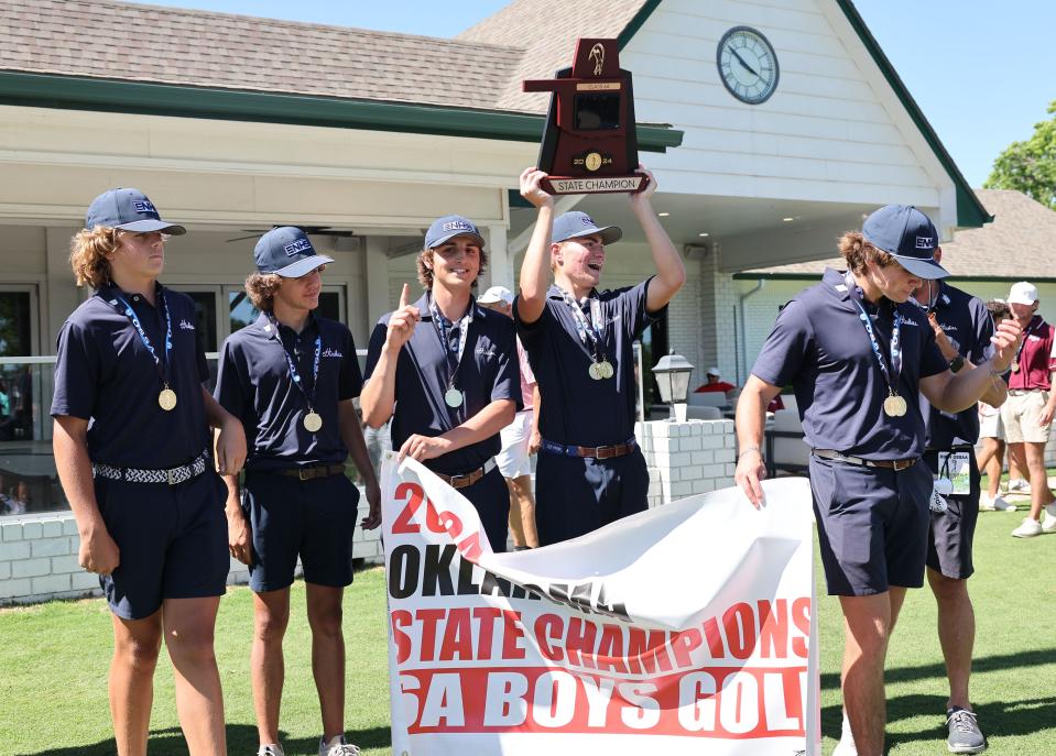 Edmond North celebrates winning the Class 6A boys golf state tournament in Tulsa on Tuesday.