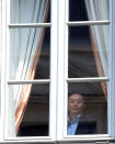 David Han Li looks from notary's office window during the transfer of ownership of AC Milan from Silvio Berlusconi's Fininvest to China's Li Yonghong in Milan, Italy April 13, 2017. REUTERS/Daniele Mascolo