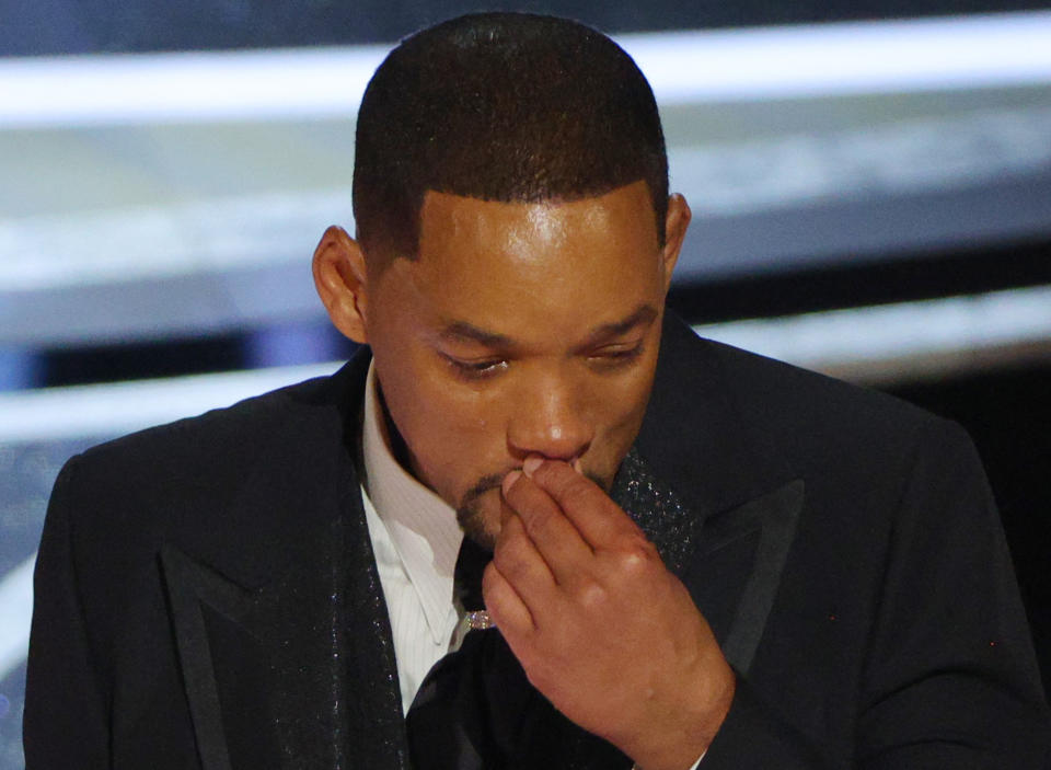 Will Smith pauses as he accepts the Oscar for Best Actor in 