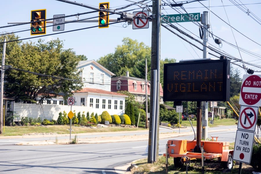 Signs warning locals and drivers passing through to remain vigilant as the manhunt continues for the escaped murderer Danelo Cavalcante in Chadds Ford, Pa., on Wednesday, Sept., 6, 2023. Cavalcante was able to escape a prison yard in suburban Pennsylvania last week by climbing up a wall and over razor wire, officials said at a news conference Wednesday. (Tyger Williams/The Philadelphia Inquirer via AP)