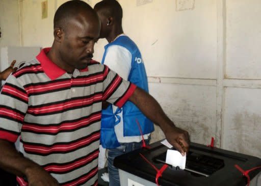 A man casts his vote in Monrovia during Liberia's constitutional referendum, just weeks before its second post-war presidential election, which some opposition leaders have boycotted. Liberians voted Tuesday in a constitutional referendum that was marred by a low turnout and ballot paper misprint, just weeks before the nation's second post-war presidential election