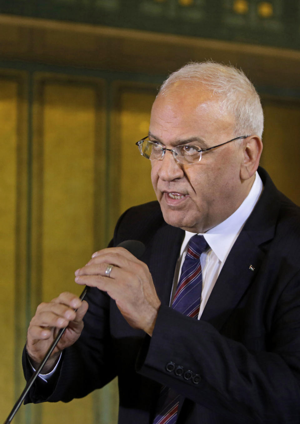 FILE - In this Aug. 11, 2014 file photo, Palestinian negotiator, Saeb Erekat, speaks during a press conference, following an emergency meeting at the Arab League headquarters in Cairo, Egypt. Erekat, a veteran peace negotiator and prominent international spokesman for the Palestinians for more than three decades, died Tuesday, Nov. 10, 2020. He was 65. (AP Photo/Amr Nabil, File)