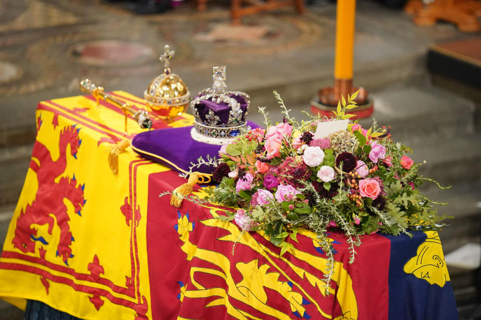 LONDON, ENGLAND - SEPTEMBER 19: The coffin of Queen Elizabeth II, draped in the Royal Standard with the Imperial State Crown and the Sovereign's Orb and Sceptre, during the State Funeral of Queen Elizabeth II at Westminster Abbey on September 19, 2022 in London, England.  Elizabeth Alexandra Mary Windsor was born in Bruton Street, Mayfair, London on 21 April 1926. She married Prince Philip in 1947 and ascended the throne of the United Kingdom and Commonwealth on 6 February 1952 after the death of her Father, King George VI. Queen Elizabeth II died at Balmoral Castle in Scotland on September 8, 2022, and is succeeded by her eldest son, King Charles III. (Photo by Dominic Lipinski - WPA Pool/Getty Images)