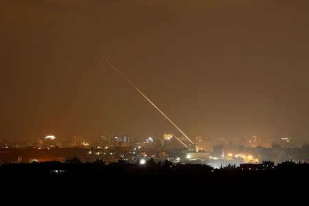 Streaks of light are pictured as rockets are launched from the northern Gaza Strip towards Israel, as seen from Sderot, Israel August 8, 2018. REUTERS/Amir Cohen